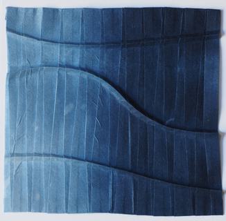 Curves across pleats 1 (blue). Dyed kozo paper, folding. Sold.