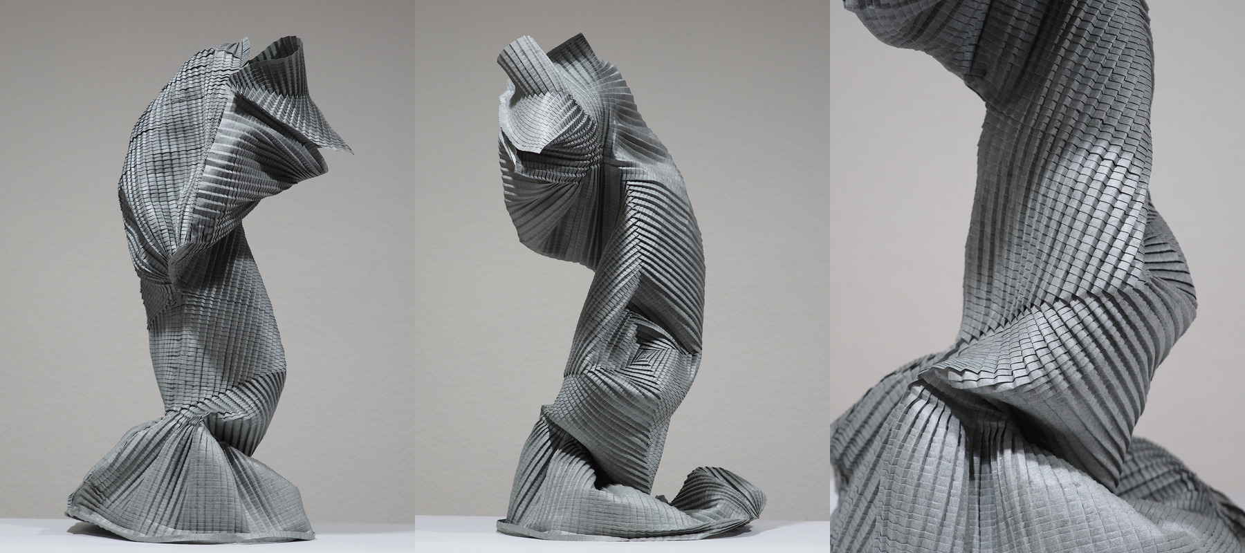 Three views of a large folded sculpture